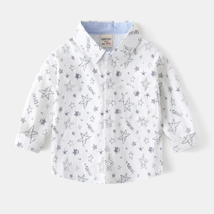 Detailed view of white cotton shirt with navy star prints and woven collar label