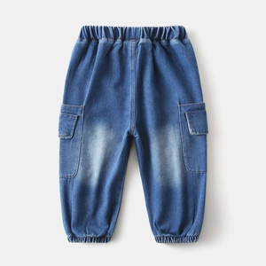 Close-up of boys' denim joggers featuring elastic waist and functional cargo pockets