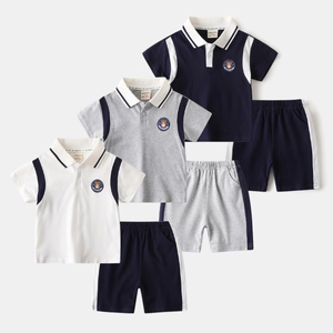 Detailed view of kids cotton polo sets in three colors with cute bear chest badges