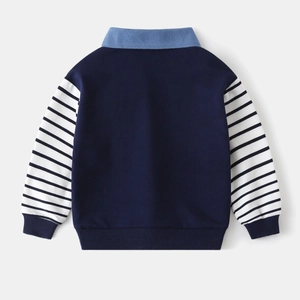 Close-up of navy blue boys sweatshirt with light blue polo collar and striped sleeve detail