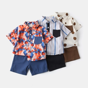 Detailed flat lay of three boys' summer cotton shirt and shorts sets with various prints