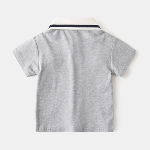 Macro view of short-sleeved cotton polo shirt back with striped white collar