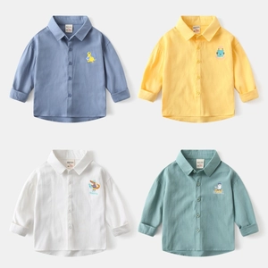 Close-up of four-color kids cotton shirts with cute animal embroidery details