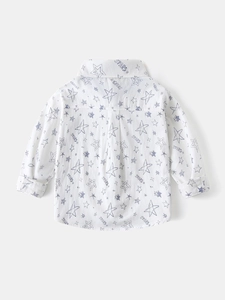Back view of boys' long sleeve white shirt with blue star pattern and collar detail