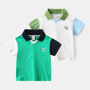 Detail of color-block polo shirt featuring embroidery and soft fabric texture