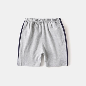 Close-up of light gray knit cotton shorts with dark blue side stripes and elastic waist
