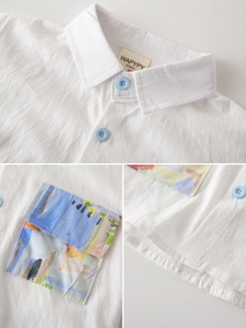 White cotton boys' shirt featuring an artistic colorful oil painting pocket detail