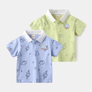Detailed view of kids dinosaur print polo shirts in breathable cotton pique fabric