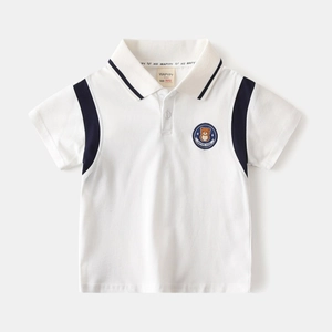 Close-up of boys' cotton polo shirt featuring striped shoulders and cute bear embroidery