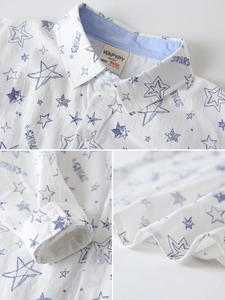 Boys white long sleeve shirt with blue star patterns and letter print in a trendy casual style