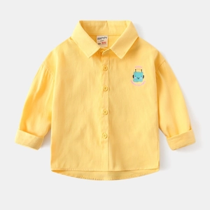 Close-up of yellow cotton shirt featuring a blue cartoon robot and science slogan