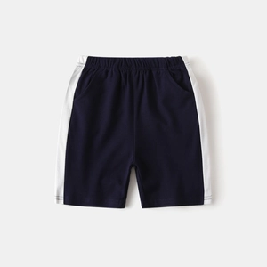 Detail of navy blue boys' sports shorts featuring elastic waist and white side stripes