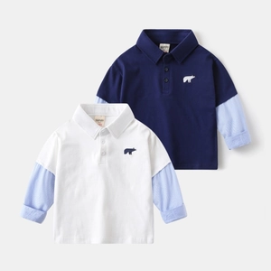 Detail of kids polo shirts with layered striped sleeves and bear embroidery patterns