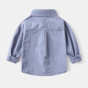 Detail view of boys' light purple corduroy shirt featuring back inverted pleat design
