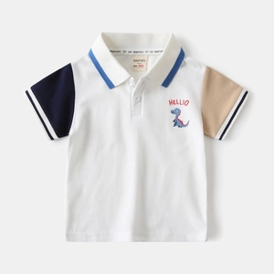 Detail of white polo shirt with dinosaur embroidery and asymmetrical color-blocked sleeves