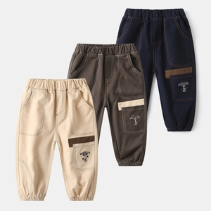 Detail of kids casual joggers with elastic waistband and cartoon puppy embroidery on side pockets