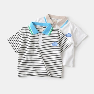 Close-up of boys' polo shirts featuring striped patterns and hippo embroidery detail