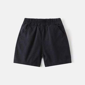 Detail of navy blue boys cotton shorts with elastic waistband and functional pockets