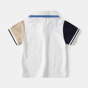 Back view of a boys' polo shirt with white body and asymmetric colored patchwork sleeves