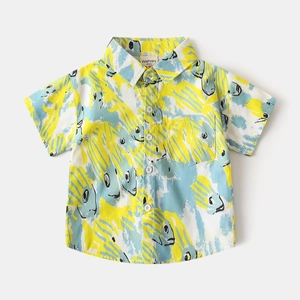 Detailed flat lay of children's short sleeve cotton shirt with yellow and blue fish print