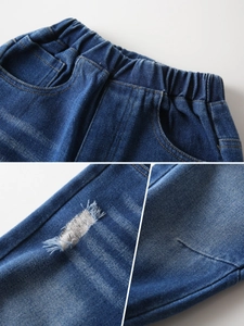 Distressed dark blue boys' denim jeans with elastic waistband and rip detail features