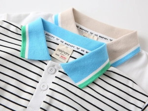 Detailed close-up of boy's cotton polo shirt collars with striped and solid textures