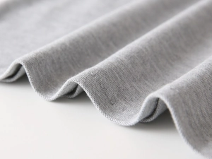 Macro view of light grey waffle knit fabric texture for kids polo shirts and shorts set