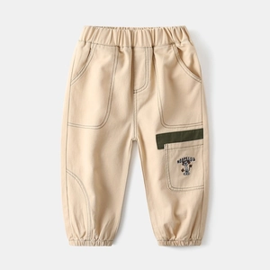 Detail of boys beige casual joggers with elastic waist and embroidered cargo pocket