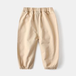 Rear view of light khaki toddler pants featuring elastic waistband and tapered leg cuffs