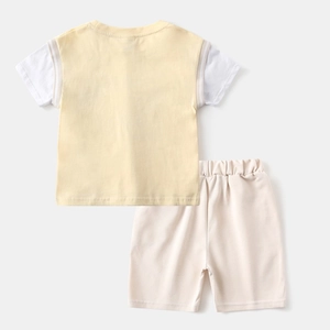 Back view of yellow and white toddler boy cotton short sleeve shirt and shorts set