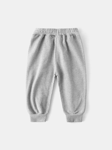 Pantalon de jogging gris pour enfants avec taille élastique et chevilles côtelées, vue à plat
