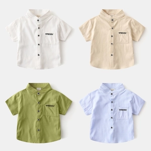 Detail of short-sleeve boys' shirts showing V-neck, buttons, and embroidered pockets