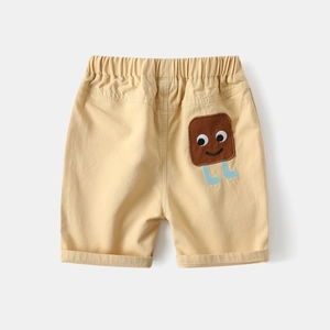 Detail of boys casual cotton shorts featuring elastic waist and cute toast cartoon pocket