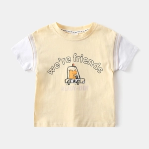 Close-up of yellow toddler t-shirt with cute hippo car print and fake two-piece sleeves