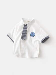 Short-sleeved white boy's shirt with navy plaid tie and space theme embroidery