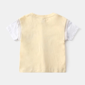 Detail view of boys summer t-shirt back with cream yellow and white patchwork design