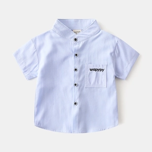 Detail of light blue boys short sleeve shirt with v-neck and wapypy pocket embroidery