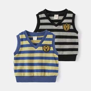 Detailed close-up of V-neck striped knit vests with embroidered crown shield emblem