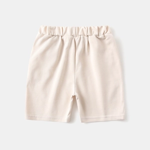 Close-up of beige cotton knit toddler shorts with comfortable elastic waistband