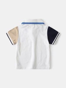 Boy's color-block polo shirt in white with navy and beige sleeves in a classic casual style