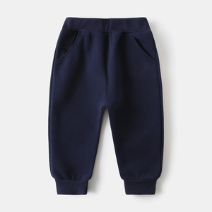 Detail of dark blue kids joggers with elastic ribbed waistband and side pockets