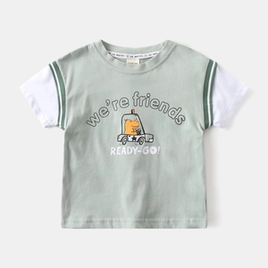 Detail of baby boys' green polo shirt featuring a cartoon hippo driving a small car