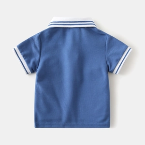 Macro shot of breathable blue pique mesh fabric and white striped collar on boys polo shirt