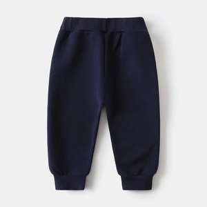 Detail view of navy blue kids joggers featuring elastic waistband and ribbed ankle cuffs