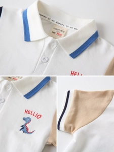 Classic white boys polo shirt with contrast sleeves and cute dinosaur embroidery