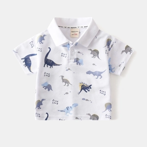 Detail of white cotton polo shirt collar featuring colorful cartoon dinosaur prints