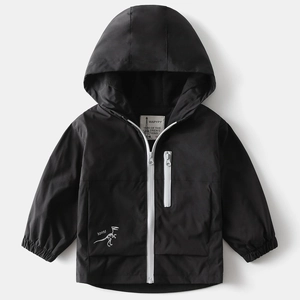Close-up of black windproof jacket with white dinosaur skeleton and ROAR text print
