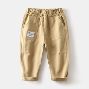 Detailed close-up of boys khaki cotton cargo pants with elastic waist and large pockets