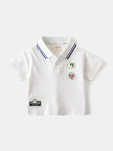 Polo en coton blanc pour garçons avec broderie de fruits et col à rayures bleues