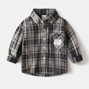 Detail view of cotton plaid shirt for boys with front chest pocket and woven label